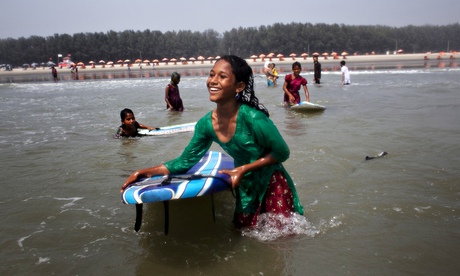 New wave  young girls surfing at Cox's Bazar, Bangladesh.