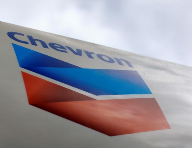 A Chevron gas station sign is pictured at one of their retain gas stations in Cardiff, California October 9, 2013. REUTERS/Mike Blake