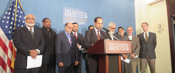(RNS1-sept24) Nihad Awad, center, executive director of the Council of American-Islamic Relations, and more than 10 Muslim-American leaders Wednesday (Sept. 24) endorse a letter written by more than 100 Islamic scholars that denounces ISIS by relying on sacred Muslims texts. For use with RNS-MUSLIM-SCHOLARS, transmitted on September 24, 2014, Religion News Service photo by Lauren Markoe.