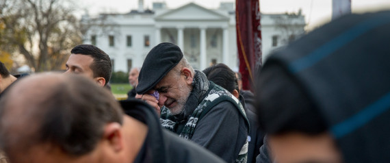 A man becomes emotional as Shiite muslims pray together and rally for peace outside of the White House, Sunday, Dec. 6, 2015, in Washington.  In a rare Oval Office address, President Barack Obama on Sunday night will urge Americans to not give into fear following attacks in Paris and California, while trying to assure the public that he takes the threat of terrorism seriously.   (AP Photo/Andrew Harnik)
