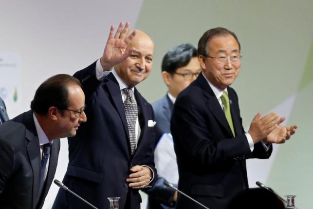 French President Francois Hollande (L) takes his seat at a plenary session with Foreign Affairs Minister Laurent Fabius (C), President-designate of COP21, and United Nations Secretary-General Ban Ki-moon at the World Climate Change Conference 2015 (COP21) at Le Bourget, near Paris, France, December 12, 2015.        REUTERS/Stephane Mahe