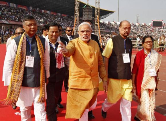 India's Prime Minister Narendra Modi (C) gestures as he arrives to address the Bharatiya Janata Party (BJP) workers meeting in Guwahati, November 30, 2014. REUTERS/Utpal Baruah